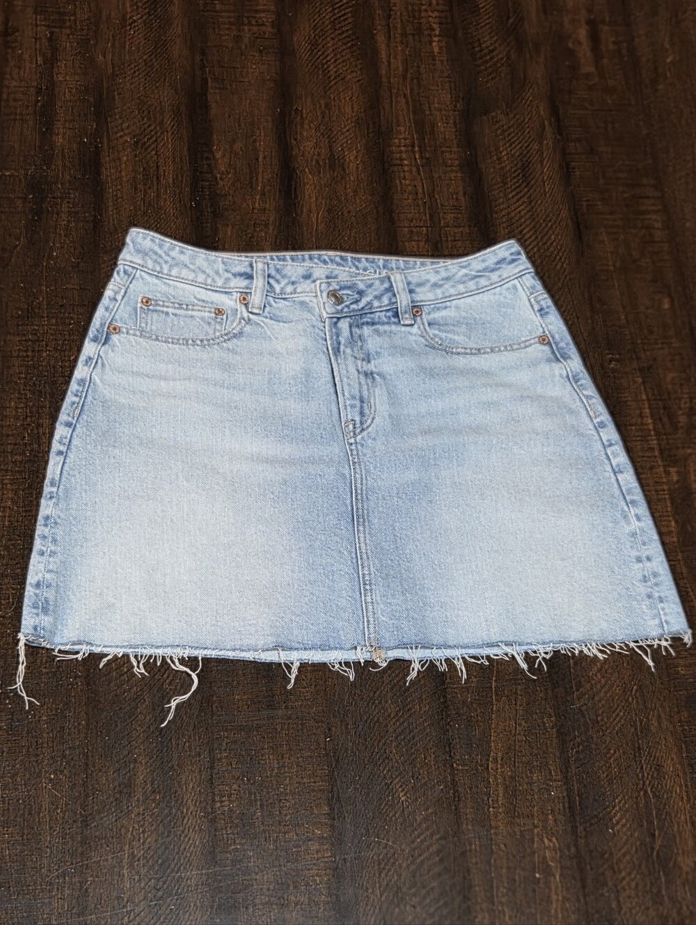 American Eagle Light Wash Denim Mini Skirt with Frayed Hem